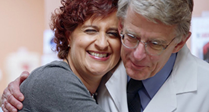 image of a patient hugging a doctor