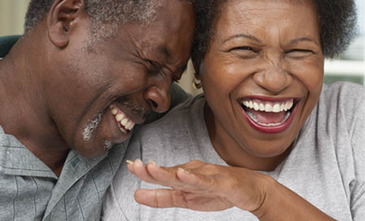 man and woman laughing together