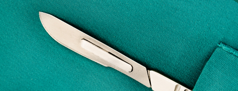 image of a scalpel in a doctor's pocket
