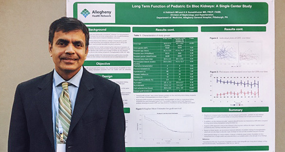 Fellow standing in front of research poster