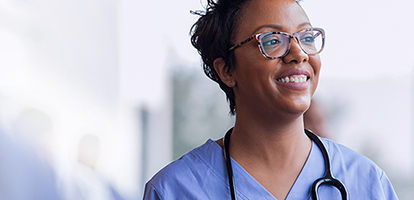 image of a doctor with a stethoscope smiling as she begins her residency with AHN