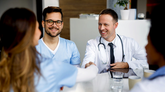 image of doctor shaking hands with a prospective AHN resident