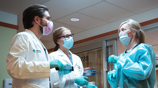 AHN physicians consulting on rounds