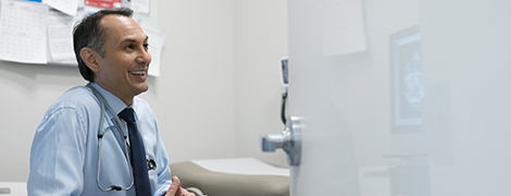 image of a doctor in his office smiling