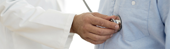 AHN physician listening to patient’s heart with a stethoscope