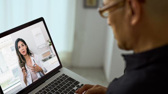 man watching video on his laptop explaining the risk factors for colorectal cancer
