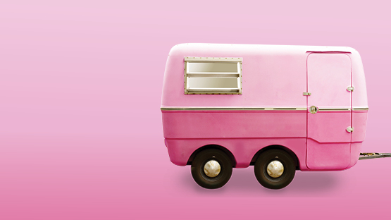 pink trailer being pulled offscreen
