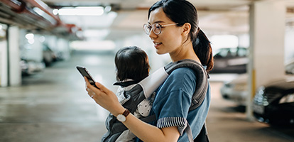 image of a woman with a baby using the mychart mobile app