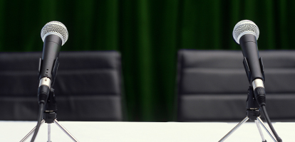 image of table with microphones for interviews