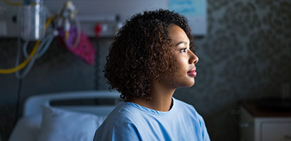image of a woman smiling in a doctor's office