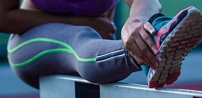 image of a woman stretching to exercise