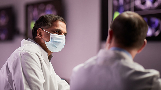 two AHN oncologists in conversation with one another