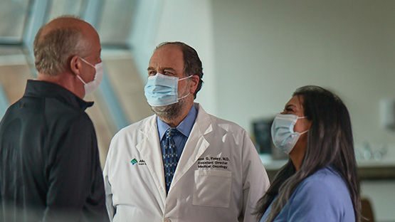 image of a group of oncologists discussing a patient