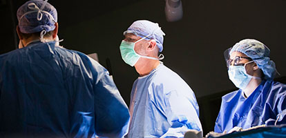 Dr Jobe focusing on surgical procedure