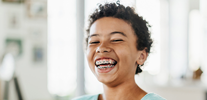 image of a girl smiling with braces