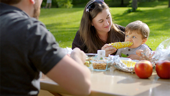 Family enjoying a picnic together