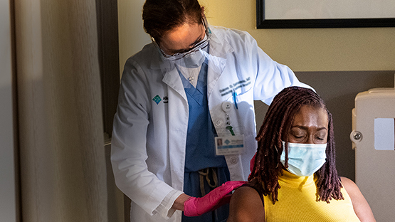 AHN physician administering nerve block injection during appointment