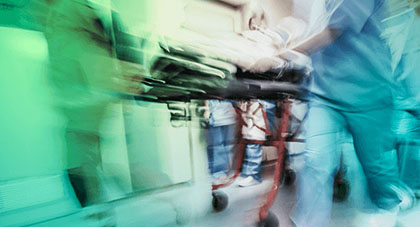 Image of a patient being rushed to the ER