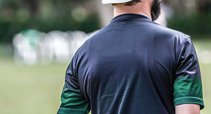 photo taken from behind a sports trainer on a football field