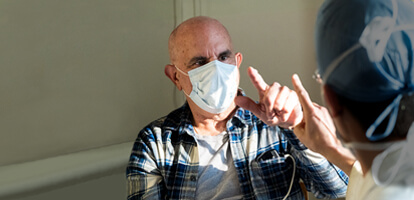AHN patient Joe testing muscular control with neurologist